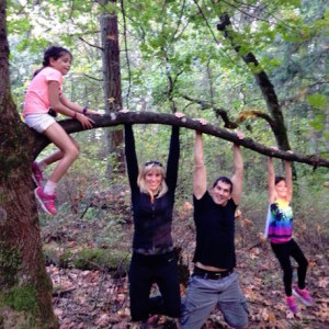 Move beyond exercise: a family hangs together on a tree